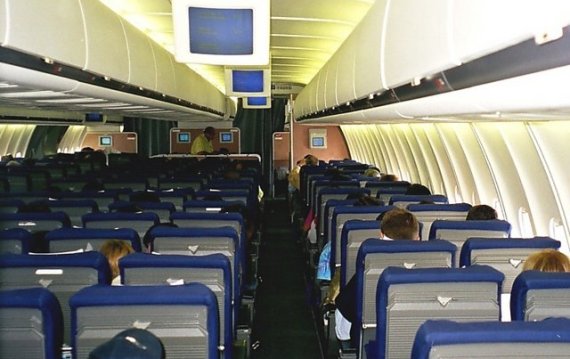 Blick in die Economy Class Kabine einer MD-11 der Swissair, Symbolbild - Foto: Philippe Gindrat