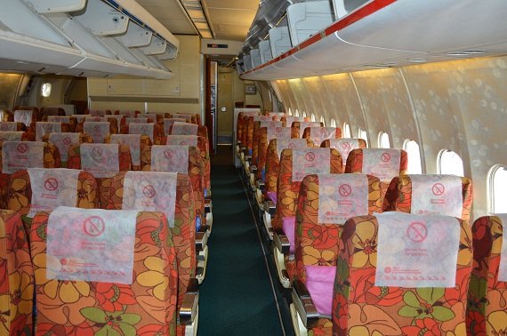 In the rear of the plane the reddish flair takes over again. The pillows color also varies.