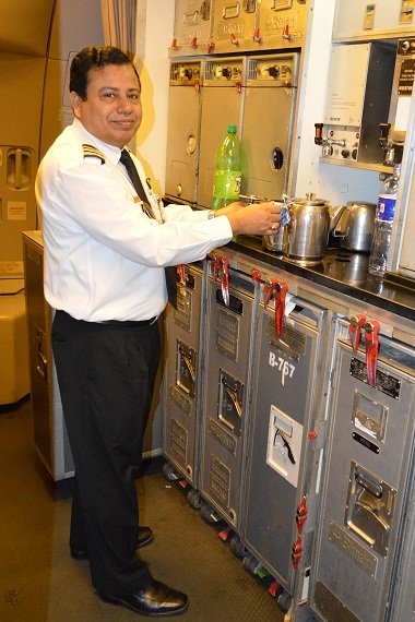 The cabin chef of the flight prepares a pot of tea