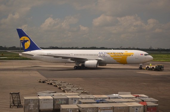 The MIAT Mongolian Airlines B767-300 is being pushed back for another flight